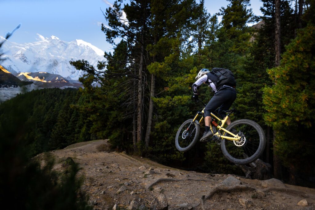 Rider descending technical singletrack near Rakaposhi Base Camp