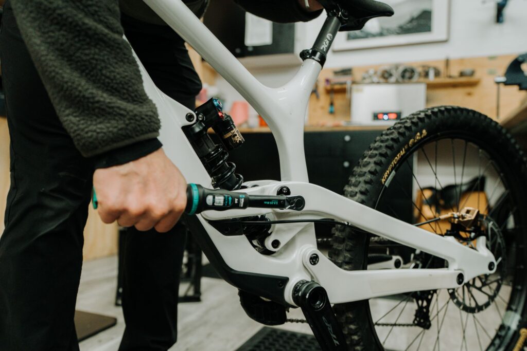 Tighten bolts on a mountain bike